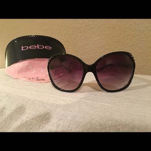 New Bebe sunglasses with case and dust cloth.