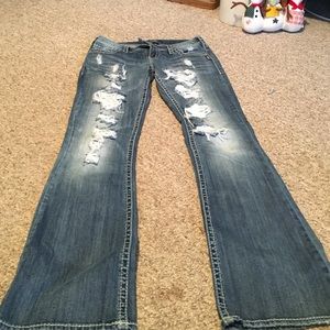 Silver distressed holey jeans