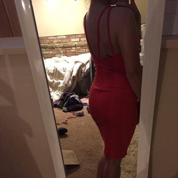 Red bodycon dress w/ plunging neckline. Never worn