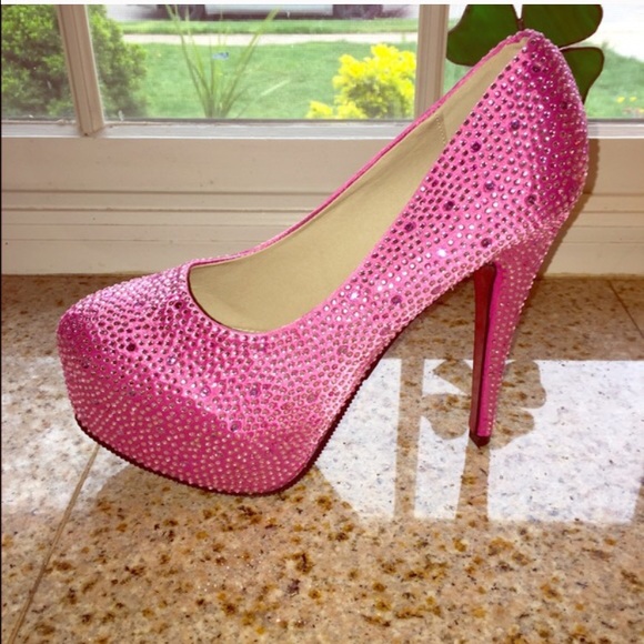 Hot pink stud heels with red sole