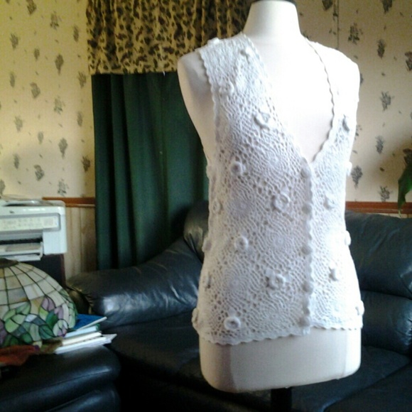 Beautidul white crochet vest.