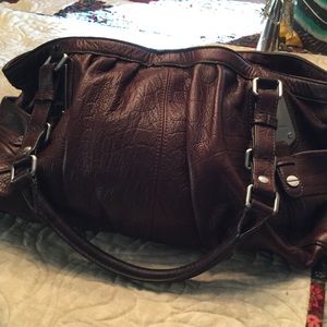 Supple chocolate brown leather bag.