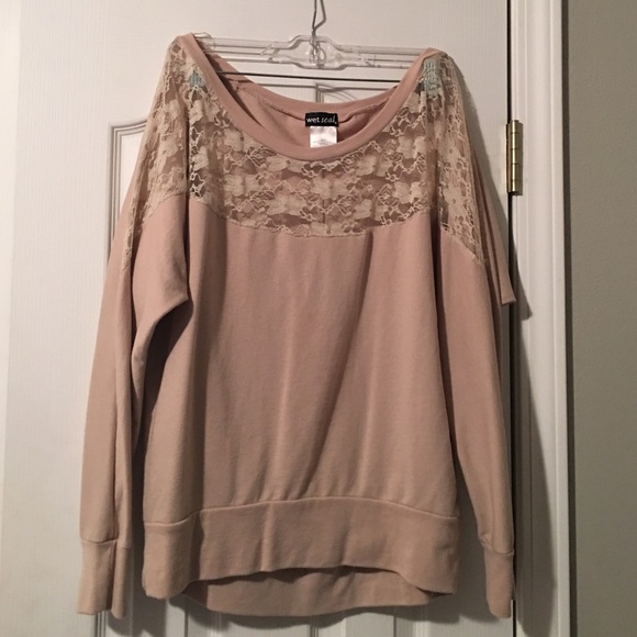 Beige sweater with sheer top.