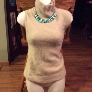Sleeve-less high neck sweater