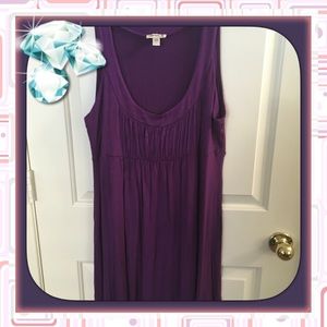 Purple dress. Sleeveless.