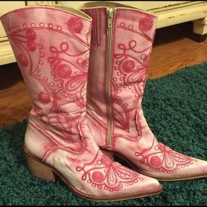 Pink embroidered western cowgirl boots.