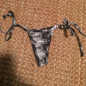 Black and white thong bathing suit bottoms