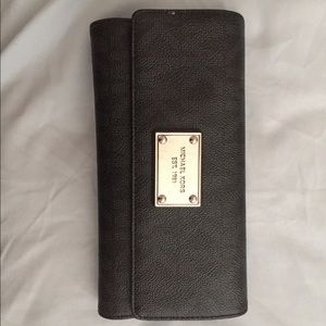 Michael Kors black wallet and checkbook case.
