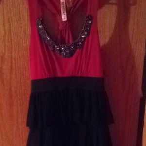 I'm selling this dress because I'll never wear it.