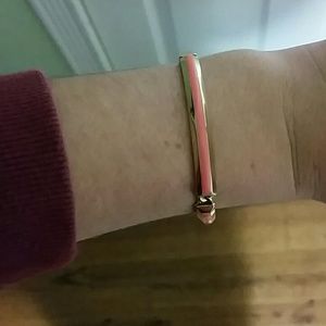 Plated gold and pink fossil bracelet