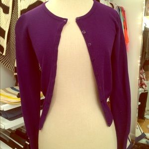 Dark purple cardigan.