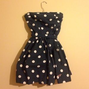 Dark blue strapless polka dotted Hollister dress.