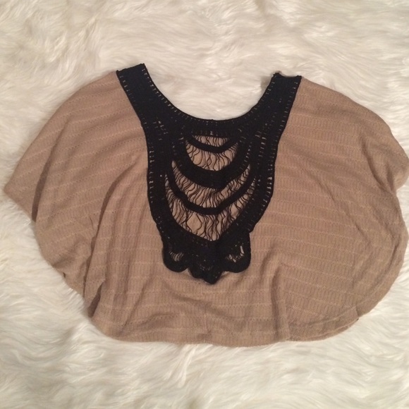 Beige top with embroidery on back