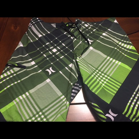 Hurley, green men's swim trunks .