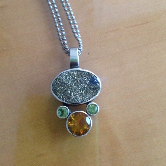 Artisan crafted peridot and citrine pendant.