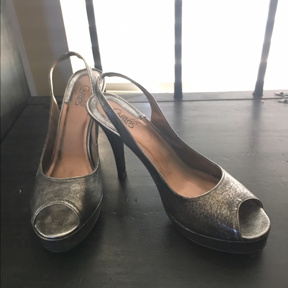 Silver sling back peep toe pumps.
