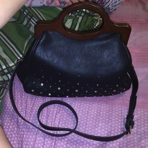 a black purse with diamonds in the bottom!