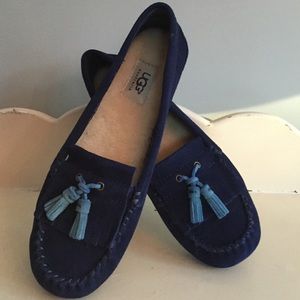 Blue suede UGG loafers.