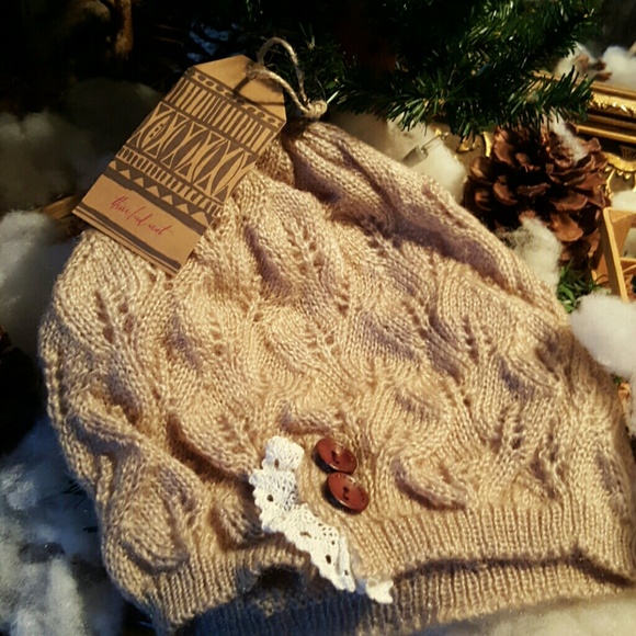 open knit, crochet lace trim, and satin buttons. - Picture 2 of 3