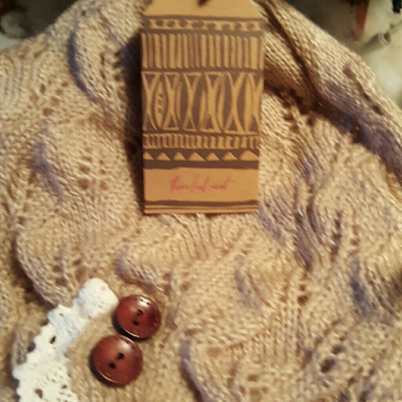 open knit, crochet lace trim, and satin buttons. - Picture 3 of 3