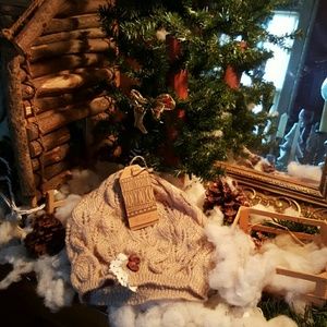 open knit, crochet lace trim, and satin buttons.