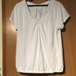 White with a silver lined v-neck