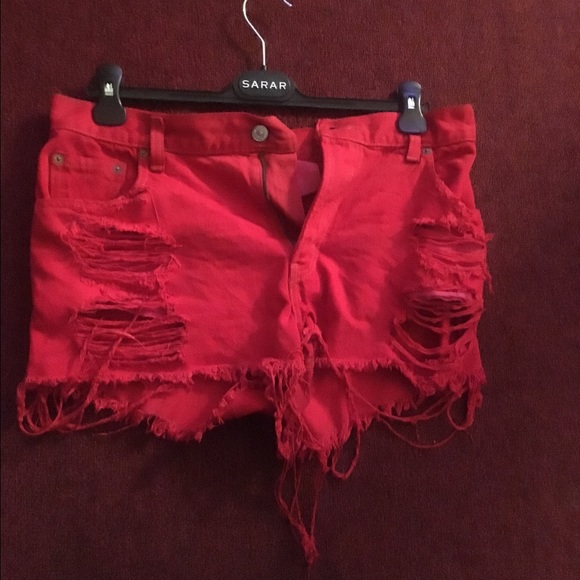 Red distressed shorts