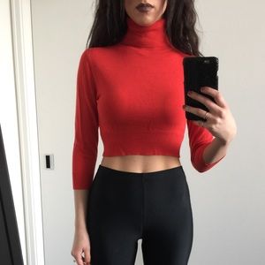 Red orange turtle neck.