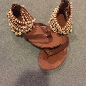 Beachy sandals with shell and pearl embellishments