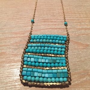 Turquoise color and gold necklace