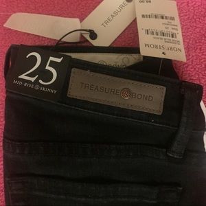 Dark blue mid rise skinny jeans never worn.