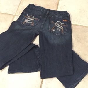 Seven jeans. Dark, shines on the bum.