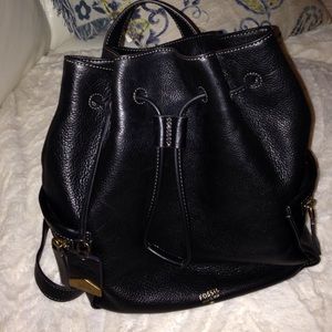 Fossil leather purse backpack style.