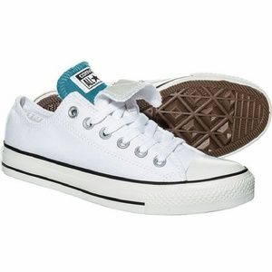 White converse with a blue and pink tongue. Worn.