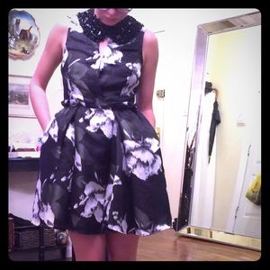 Green and black floral embellished bib dress