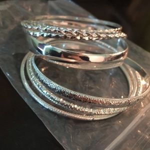 An 8 piece set of silver bangles