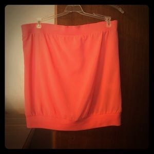 Strapless coral top.