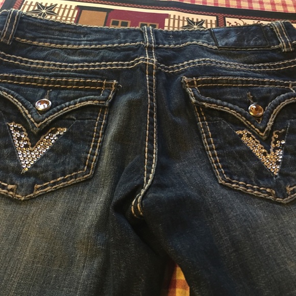 some rhinestones are missing on back pocket