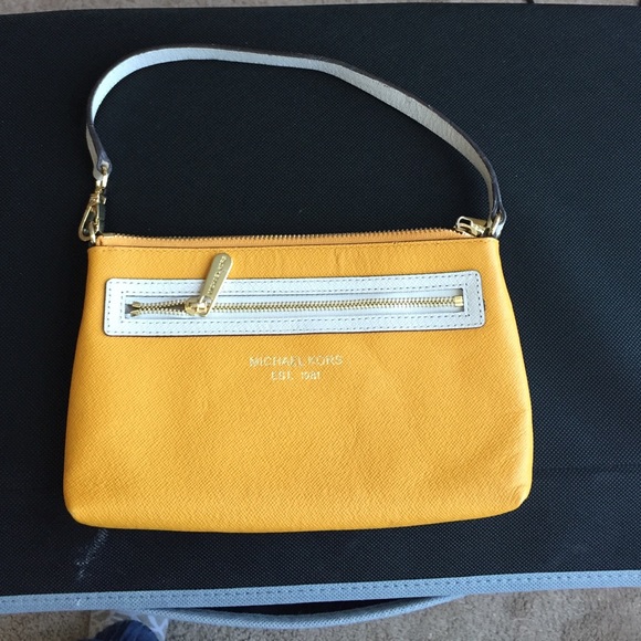 MK wristlet. Yellow orange color