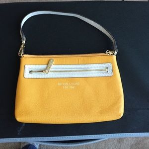 MK wristlet. Yellow orange color