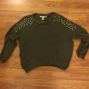 Studded shoulder sweater.