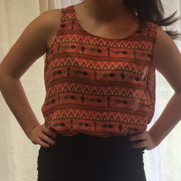 Orange patterned top with partially open back.