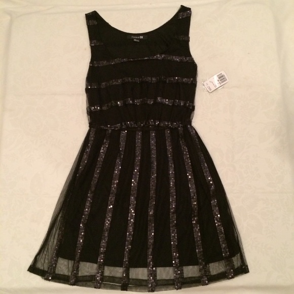 Short length black dress.