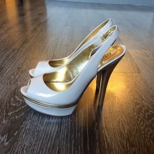 Nude patent slingback heels