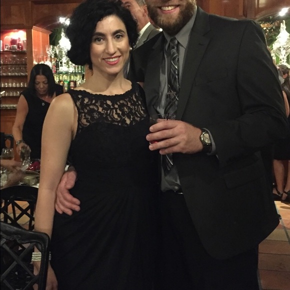 Floor length black chiffon dress, center slit.