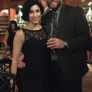 Floor length black chiffon dress, center slit.