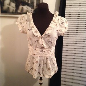 Raccoon cream blouse