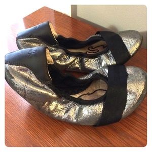 Silver and black puma flats