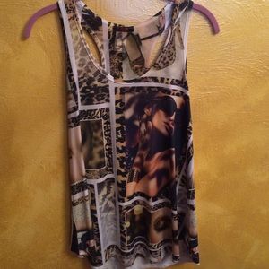 Model and leopard print graphic tank top.