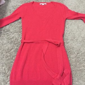 Tunic red sweater; low cut.